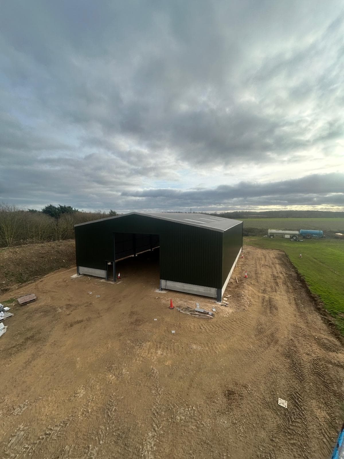 Finished agricultural machinery store with completed cladding and access doors