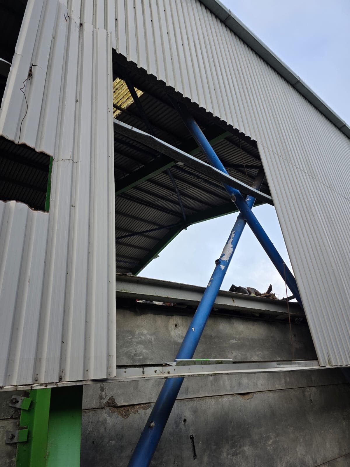 Industrial cladding repair opening detail with structural work exposed